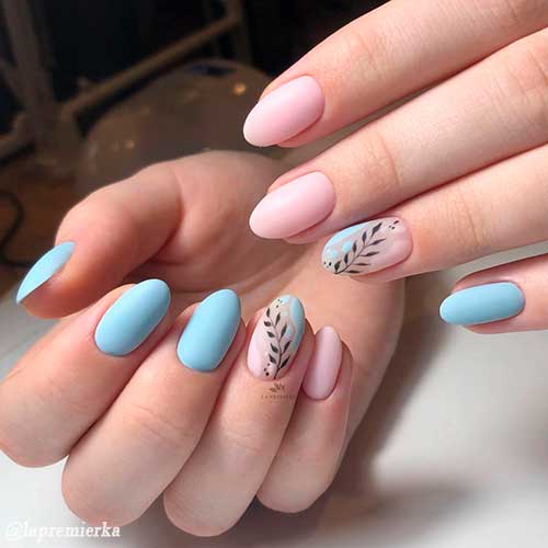 Matte light blue nails with light pink nails and leaf nail art on accent nail design! Matte light blue nails with light pink nails and leaf nail art on accent nail design!