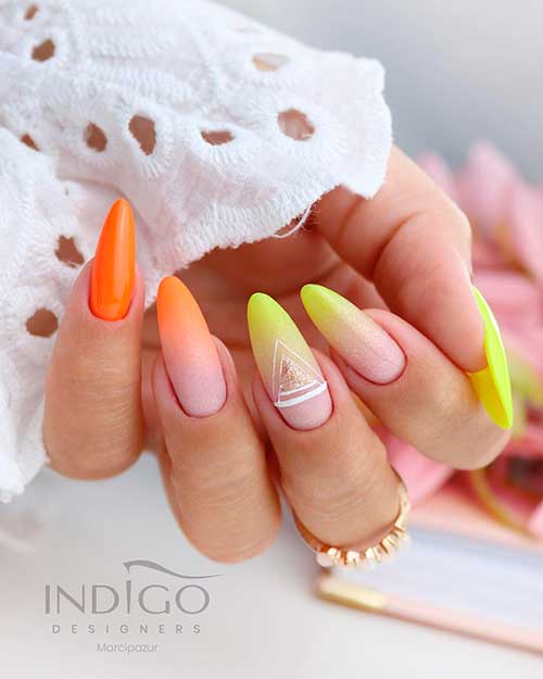 Ombre Orange and Yellow Neon Nails Cute neon nails 2021 that blend ombre neon orange nails with ombre neon yellow nails for the summertime!