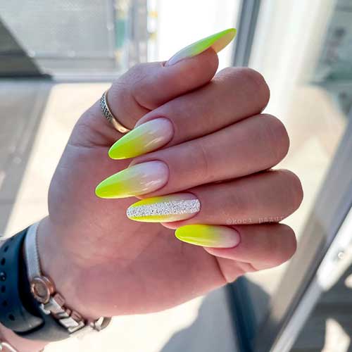 Fancy yellow ombre neon nails 2021 with wide glitter strip on accent nail for the summertime!
