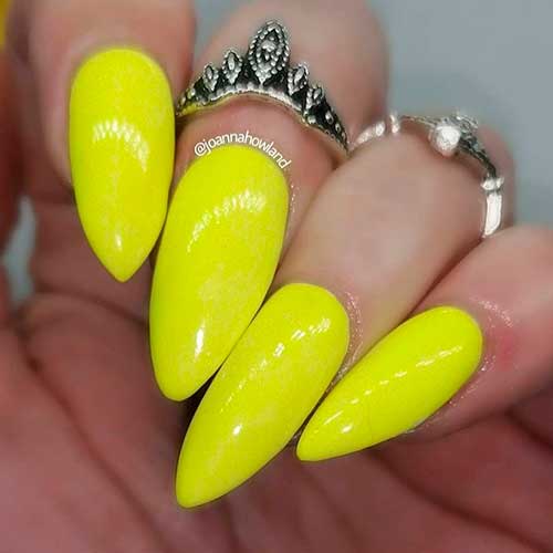 Fierce stiletto shimmering yellow neon nails for summer!