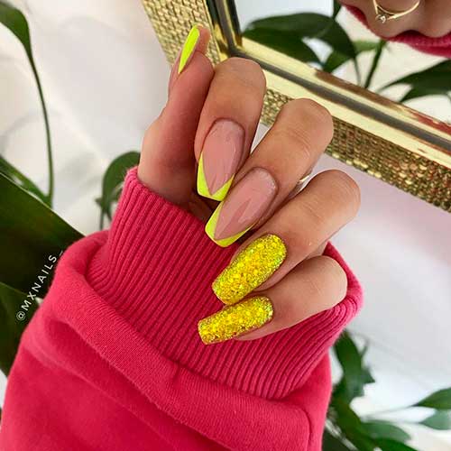Glittery and glam neon yellow nails 2021 that blends V French tip nails with two accent glitter nails!