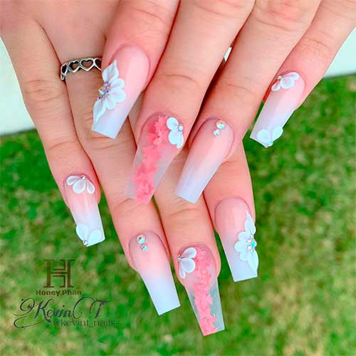 Long coffin-shaped French ombre nails 2023 with rhinestones and 3d white flowers for the spring and summer seasons