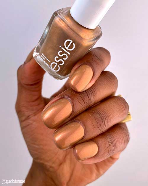 Essie Nail Polish Light as Linen, a milky brown nail polish with refined red pearls