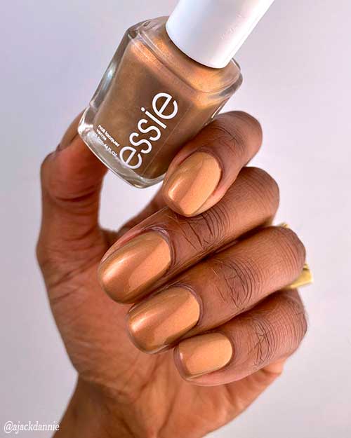 Essie Nail Polish Light as Linen Essie Nail Polish Light as Linen, a milky brown nail polish with refined red pearls