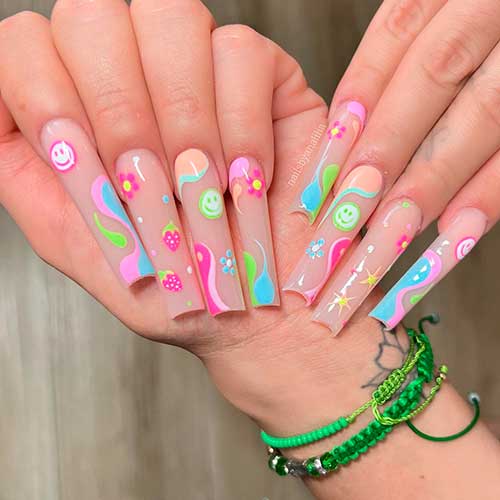 Long neon smiley face nails 2022 with strawberry, flowers, and abstract nail art