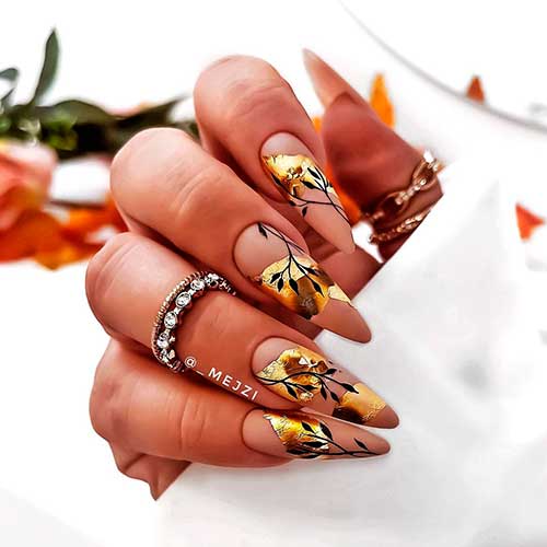 Stunning Almond Nude Fall Nails with Golden Patches and Black Fall Leaves