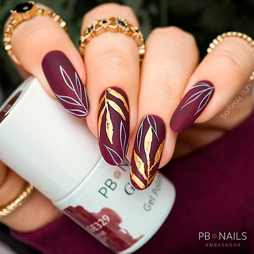 Matte Pale Purple nails With white and gold fall Leaves are one of the best Fall Nail Ideas 2021