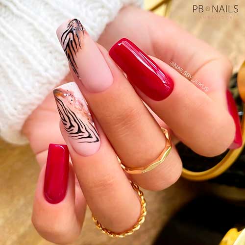 Rustic Red Nails with two accent animal print nails are perfect fall nails 2021
