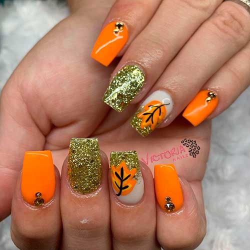 Vibrant and Glittery Autumn Orange Nails Vibrant and Glittery Autumn Orange Nails square-shaped with fall leaf, best fall nails 2021
