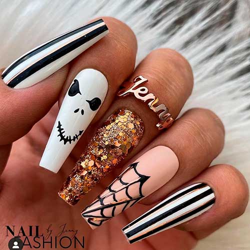Acrylic Coffin Nails with gold glitter, striped, and Spider Web nails Design is one of the best Halloween nail designs 2021