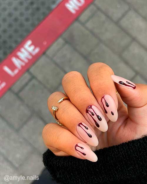 Elegant But Creepy Bloody Nails are simple Halloween Nails Ideas to Try in 2021