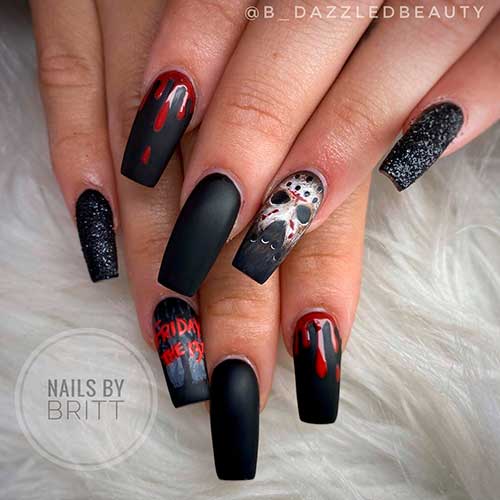 Long square matte black coffin nails with blood drops, skull, and glitter nails for Halloween 2021