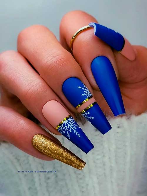 Blue Winter Nails with Snowflakes, Gold Strips, and Gold Glitter Accent