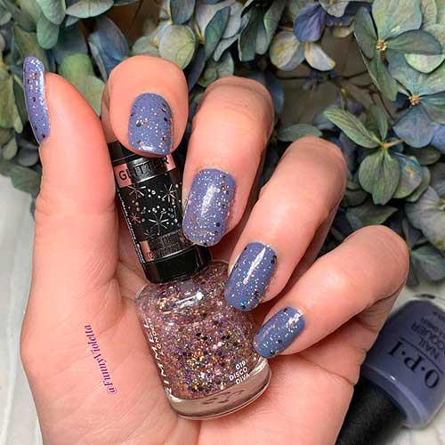 Short Gray Nails with Glitter for Fall 2021 uses OPI DTLA Nail Polish form OPI Nail Polish Collection Downtown LA