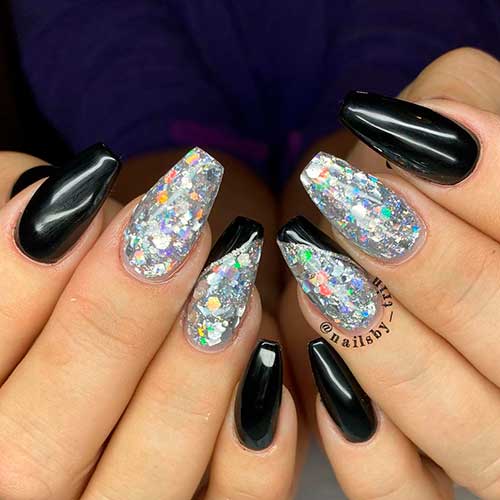 Medium coffin black and silver nails are perfect as winter nails Medium coffin black and silver nails are perfect as winter nails