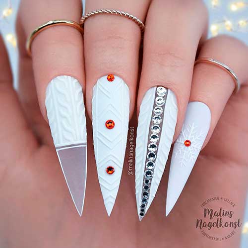 White Stiletto Christmas Sweater Nails 2021 with Rhinestones and a Snowflake on Accent Nail