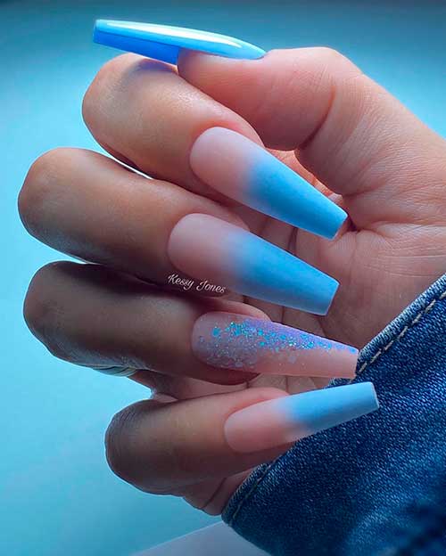 Ice blue ombre coffin winter nails with glitter on accent nude color nail