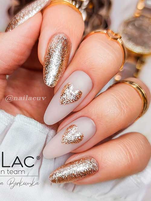 Almond Gold Glitter valentines day nails 2022 with Gold Glitter Hearts On Two Accents Almond Gold Glitter valentines day nails 2022 with Gold Glitter Hearts On Two Accents