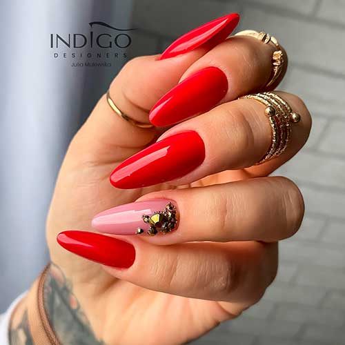 Cute Glossy Red Nails with Pink Accent Adorned with Gold Rhinestones