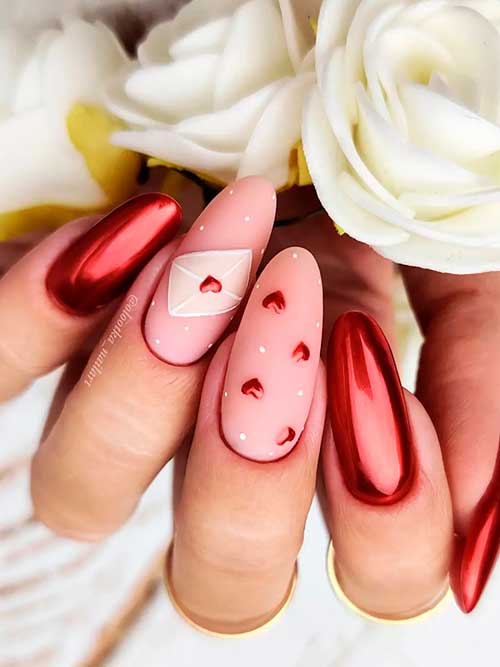 Long Round Metallic Red valentines day nails 2022 with red hearts over two nude accents Long Round Metallic Red valentines day nails 2022 with red hearts over two nude accents