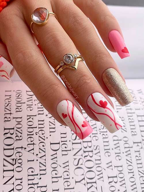 Long Square White and pink valentines day nails 2022 with red hearts and swirls and gold glitter accent Long Square White and pink valentines day nails 2022 with red hearts and swirls and gold glitter accent