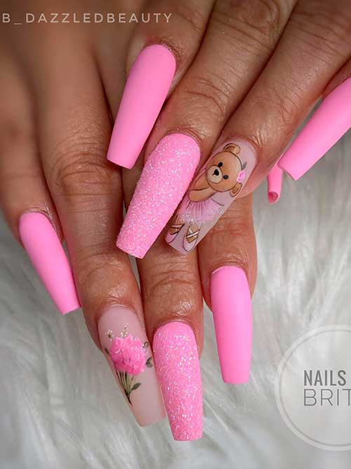 Long coffin-shaped matte Pink valentines day nails 2023 with a teddy bear, sugar glitter, and flowers on accent nails
