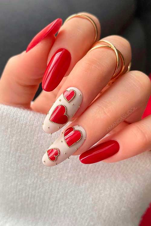 Round White and Red Valentines Day Nails Long Round Red Valentines Day Nails with Red Hearts on Two White Accents Adorned with Rhinestones