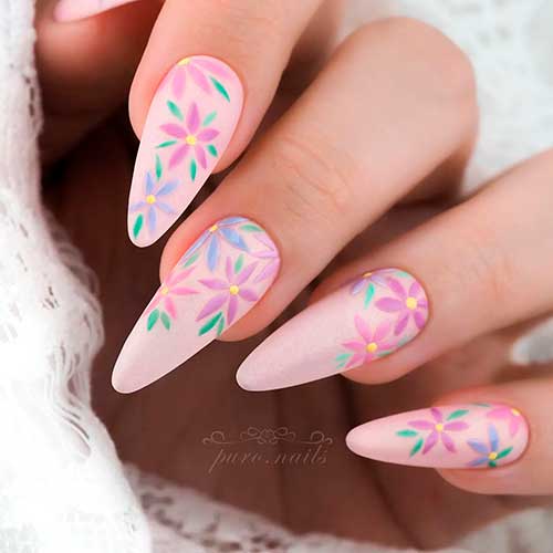 Cute long almond pastel pink spring nails with floral nail art on nail tips - Floral Spring Nail Designs