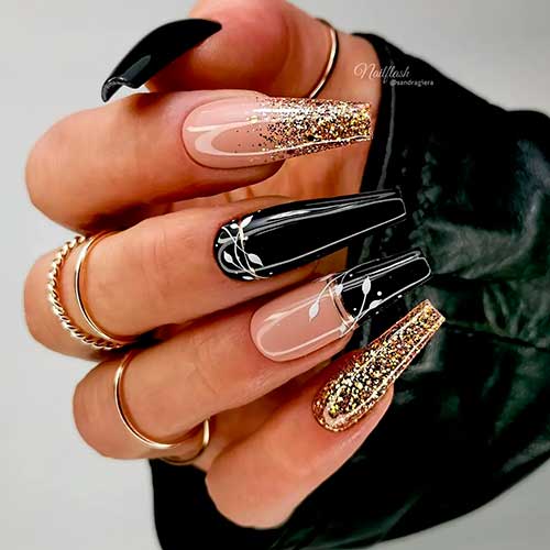 Long Glossy coffin black nails with Nude, White Leaves, and Gold Glitter - One of the cutest black nail designs 2022