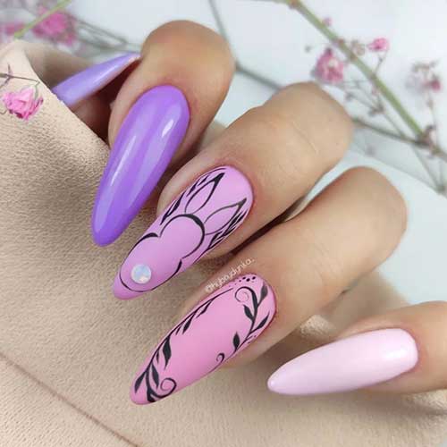 Long almond purple to pink easter nails with an adorable bunny design and leaf nail art on two accent nails
