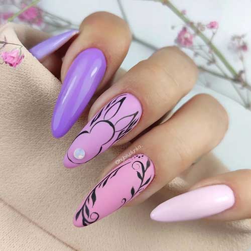 Purple to Pink Easter Nails Long almond purple to pink easter nails with an adorable bunny design and leaf nail art on two accent nails
