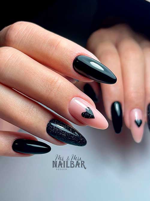 black valentine’s day nails Long almond-shaped black valentine’s day nails 2023 with a heart shape on a nude accent nail