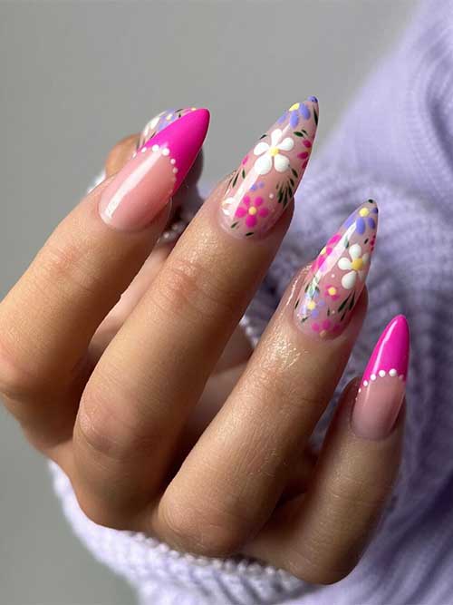 Pink, White, and Purple Floral Spring Nails Long almond-shaped pink, white, and purple floral spring nail design 2023 with two pink French accent nails
