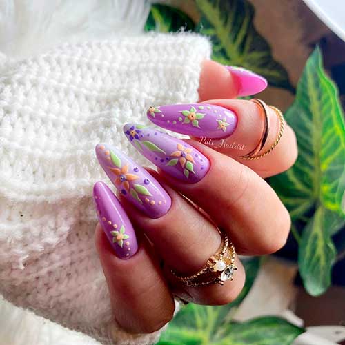 Long almond shaped spring flower nails with purple base color