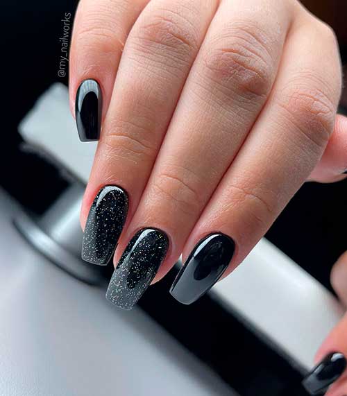 Long glossy black nails with two accent glitter black nails design - Classy Black Nail Designs 2022