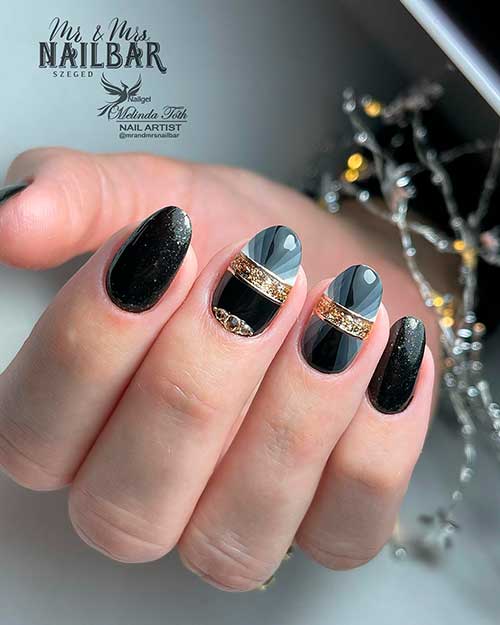 Round medium black nails with gold glitter, and rhinestones design - Black Nail Designs 2022