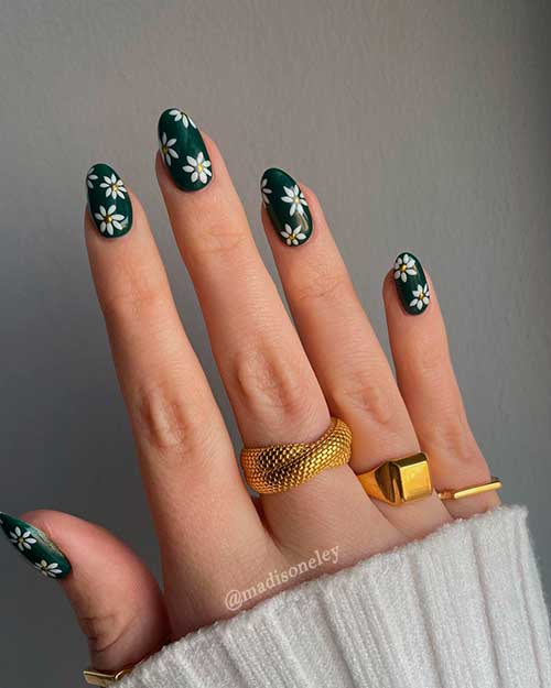 Daisy spring transition nail art on short dark green nails Daisy spring transition nail art on short dark green nails