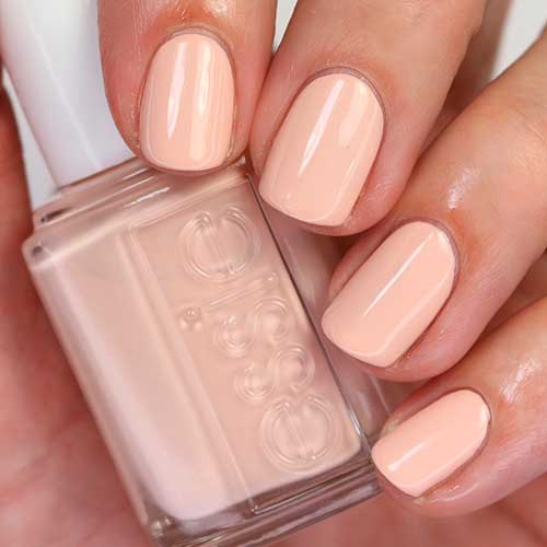 Well Nested Energy Short pastel peach nails that uses Well Nested Energy Essie nail polish for spring season