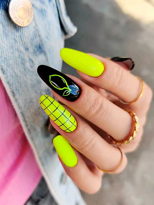 Long Almond Shaped Yellow Neon Nails 2022 with Black Design for Summertime