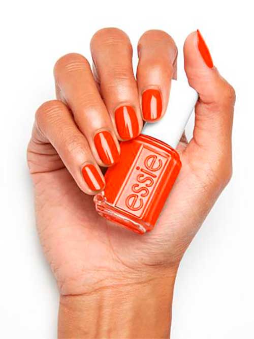 Essie risk takers only - Vibrant orange nail polish with red undertones - Short orange nails