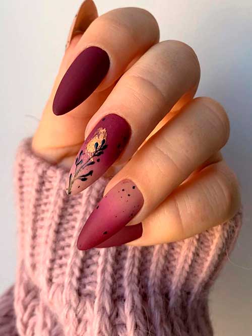 Matte burgundy ombre fall nail design with leaf nail art and a gold touch