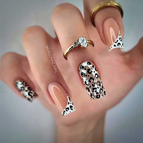 Long square shaped leopard fall manicure with two white diagonal French accent nails