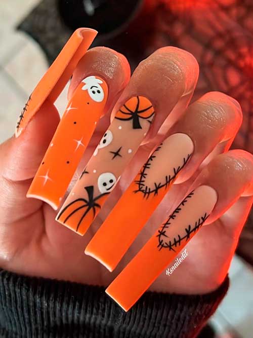 Long Orange Halloween Nails 2022 Features Pumpkins, Ghosts, and Stars