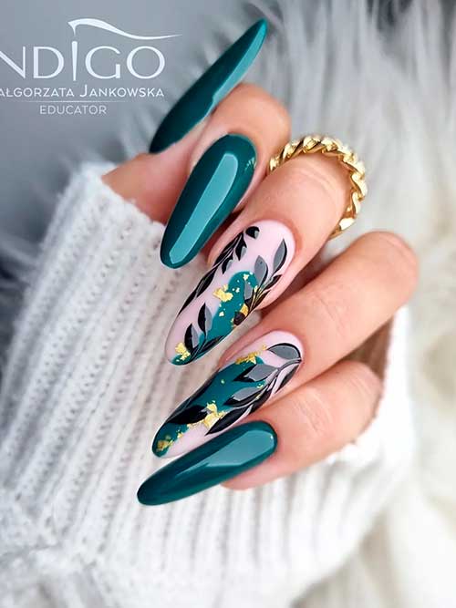 Long almond-shaped nails with leaf nail art on two accent pink nails Long almond-shaped nails with leaf nail art on two accent pink nails with gold foil flakes