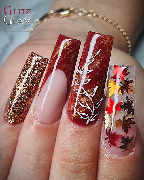 Long square shaped Brown fall nails with maple leaves and gold glitter