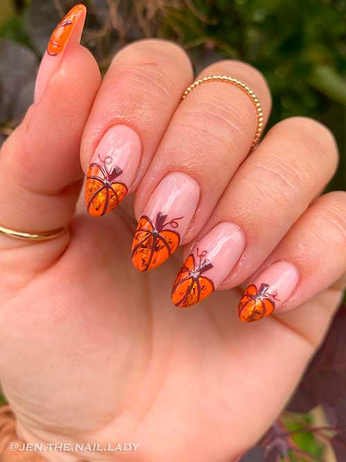 Nude fall nails with pumpkin tips Medium round shaped nude fall nails with pumpkin tips
