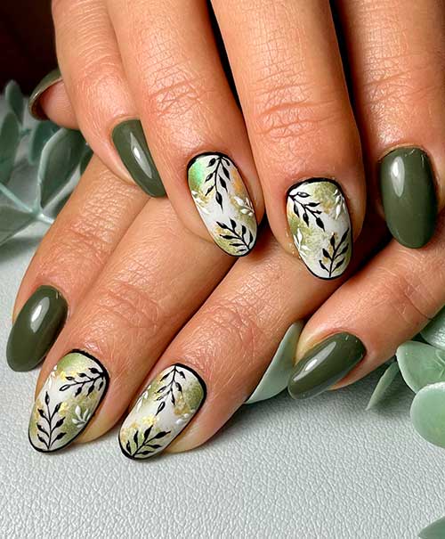 Olive green fall nails with leaf nail art on two accent nails