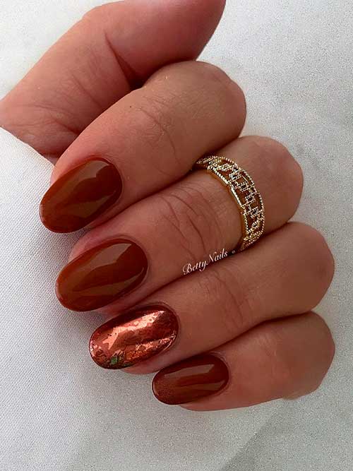 Short brown nail design with an accent mirror nail