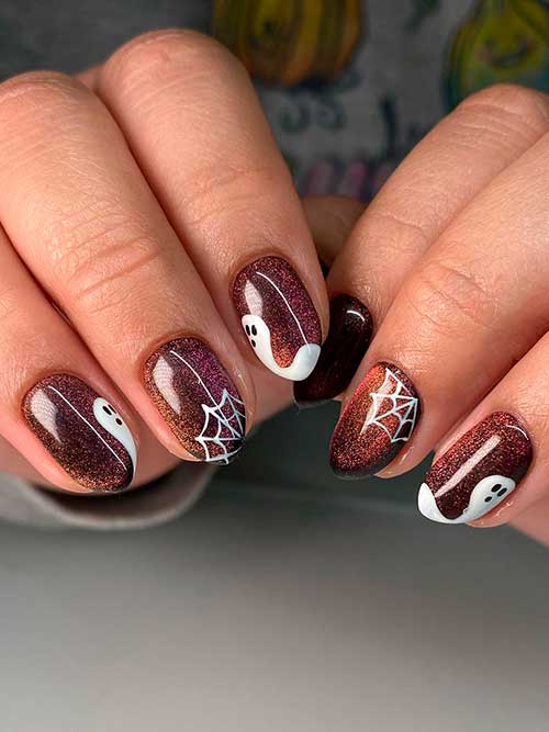 Cat eye nails with white ghosts and spider webs Cat eye nails with white ghosts and spider webs for Halloween 2022