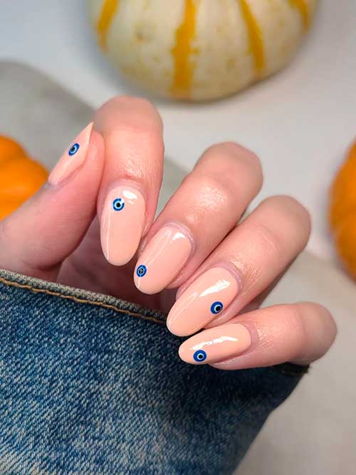 Blue Evil Eye Simple Halloween Nails 2022 with Nude Base Color